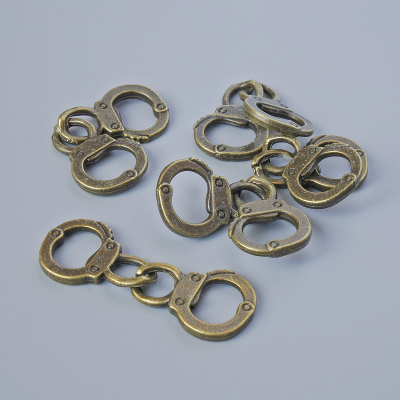 Přívěšek „Pouta“, průměr 17×11,5 mm, délka 31 mm, balení 5 ks, bronzová barva kovu