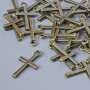Přívěšek s křížem, bronzová barva kovu, rozměry 18×10 mm, otvor o průměru 1,3 mm, balení 30 ks ±