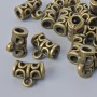 Furnitura poutko – držák, průměr 12×6 mm, průměr otvoru 1,7 mm, 3 mm, délka 9,5 mm, balení 18 ks ± bronzová barva kovu