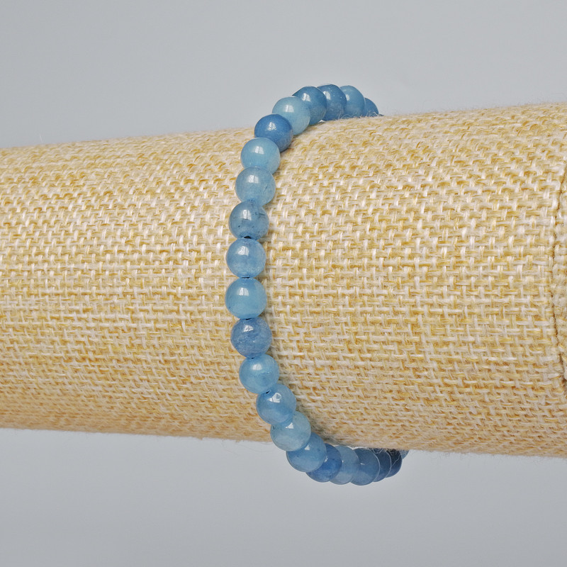 Náramek z akvamarínu (jednotlivý) hladká kulička, průměr 6 mm ±, délka 18 cm ± (elastický)