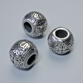 Kovová korálka-vložka, průměr 10×13 mm, díra cca 5–6 mm, stříbrná barva kovu, 1 ks