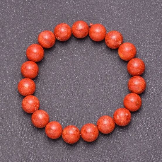 Náramek z porézního korálu s hladkou kuličkou, průměr 12 mm ±, délka 18 cm (elastický)