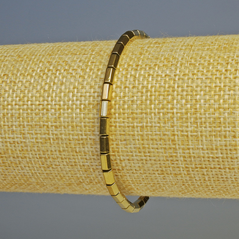 Náramek z hematitu se zlatými šestiúhelníky, průměr 5×3 mm, délka 18 cm, na gumičce