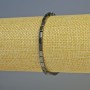 Náramek z hematitu obdélníkového tvaru, černé barvy, korálky 5×3 mm, délka cca 18 cm, elastický
