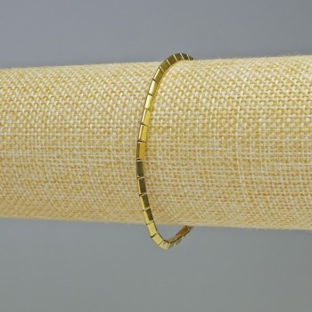 Náramek z hematitu ve tvaru trojúhelníků zlaté barvy, průměr 5×2 mm, délka 18 cm, elastický