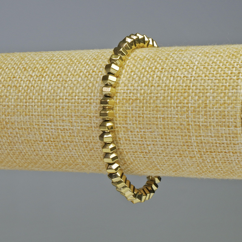 Náramek z hematitu broušené rondelky zlaté barvy, průměr 6×4 mm, délka 18 cm, elastický