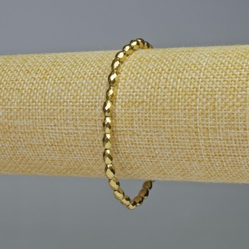 Náramek z hematitu – broušené oválné korálky zlaté barvy, průměr 4×6 mm ±, délka 18 cm ±, elastický