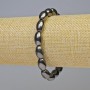 Náramek z hematitu, oválný tvar, černá barva, průměr 13×8 mm ±, délka 18 cm ±, elastická šňůrka