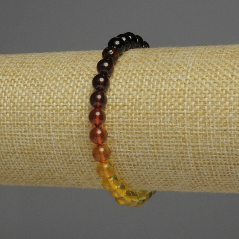 Jantarový náramek gradientní, hladké korálky, průměr 6 mm ±, délka 18 cm ±, elastický
