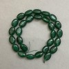 Oválné korálky z chrysoprasu, průměr 13×10 mm, navlečené na niti, délka cca 39 cm