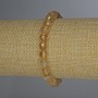 Náramek z citrínu, brusované kuličky o průměru kolem 7 mm, délka 18 cm, elastický