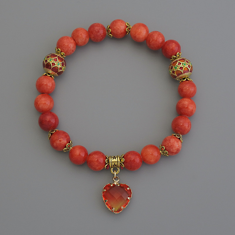 Náramek z oranžového korálu (umělý) hladké kuličky, průměr 8 mm ± cloisonné 10 mm ± s kovovými vsadkami, délka 18 cm, elastický
