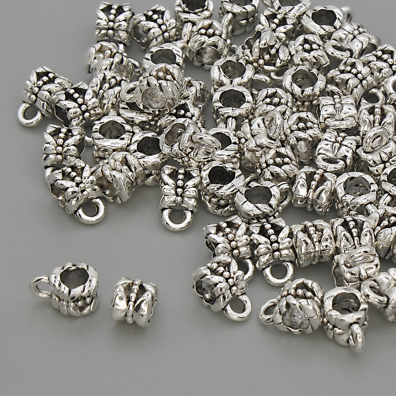 Poutko, barva kovu stříbrná, průměr 4,5×7,5 mm, otvor cca 3 mm, balení 20 g (~60 ks)