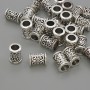 Kovová součástka – vložená korálka, barva kovu stříbrná, průměr 9×6 mm ± otvor 4,5 mm ± balení 20 g (~27 ks)