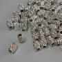 Kovová komponenta – korálková vložka, barva kovu: stříbrná, průměr 6×4 mm, díra cca 1,8 mm, balení 20 g (~ 62 ks)