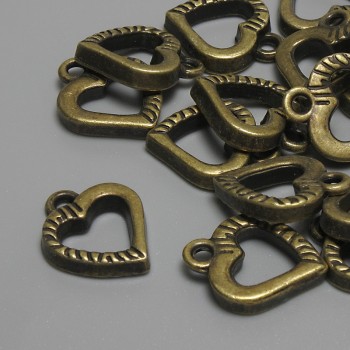 Přívěšek Srdce bronzové barvy, průměr 15×12 mm, otvor pro ouško 2,3 mm, balení 15 ks