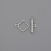 Zápínání toggle ve tvaru čtyřlístku, průměr 14×3 mm ±, průměr 10 mm ±, průměr otvoru 8 mm ±, stříbrná barva kovu
