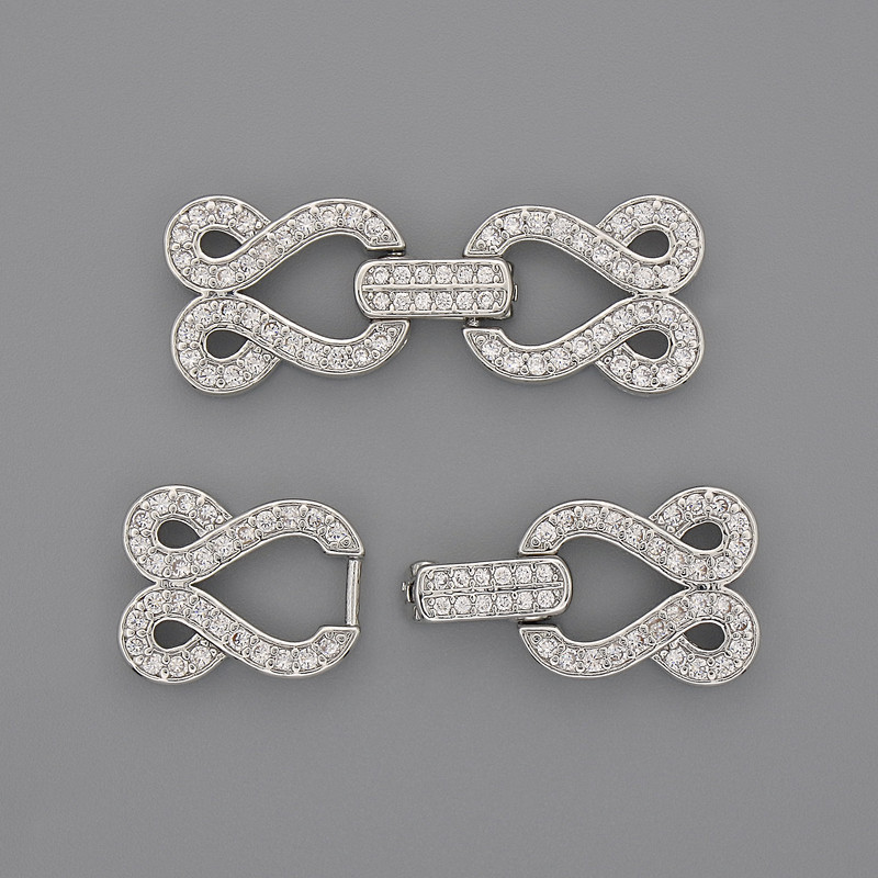 Zapínání na dvě nitě se štrasami, stříbrný odstín kovu, 30×12 mm