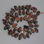Korálky z kamene Býčí oko – drobné motýlky, průměr 10-15×6-8 mm, rokajl 3 mm, délka 39 cm, na niti