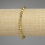 Náramek z hematitu zlatavého odstínu, s víceúhlými korálky o rozměru 4x4 mm, délka 18 cm, pružný