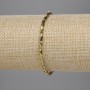 Náramek z českého křišťálu, zlatistě broušené válce 5×3 mm a korálky 2 mm, délka 18 cm, elastický