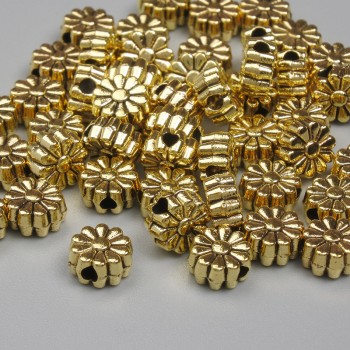 Kovové doplňky – korálková vložka, barva kovu: zlato, průměr 6×3 mm, otvor průměru cca 1,3 mm, balení 20 g (~50 ks).