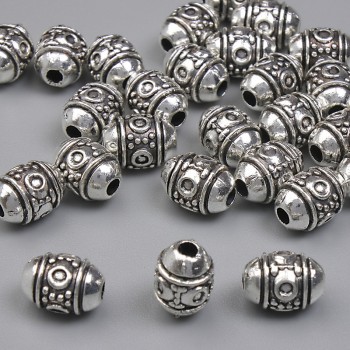 Stříbrná korálka-vložka, kovová barva, průměr 7,5×5,5 mm, otvor 1,6 mm, balení 20 g (~28 ks)