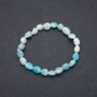Náramek z přírodního akvamarínu na elastické gumičce, fasetované korálky, průměr 7×9 mm, obvod 18 cm