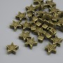 Korálka-vložka hvězda, bronzová barva, průměr 6×2,5 mm, díra 1,5 mm, balení ~25 ks