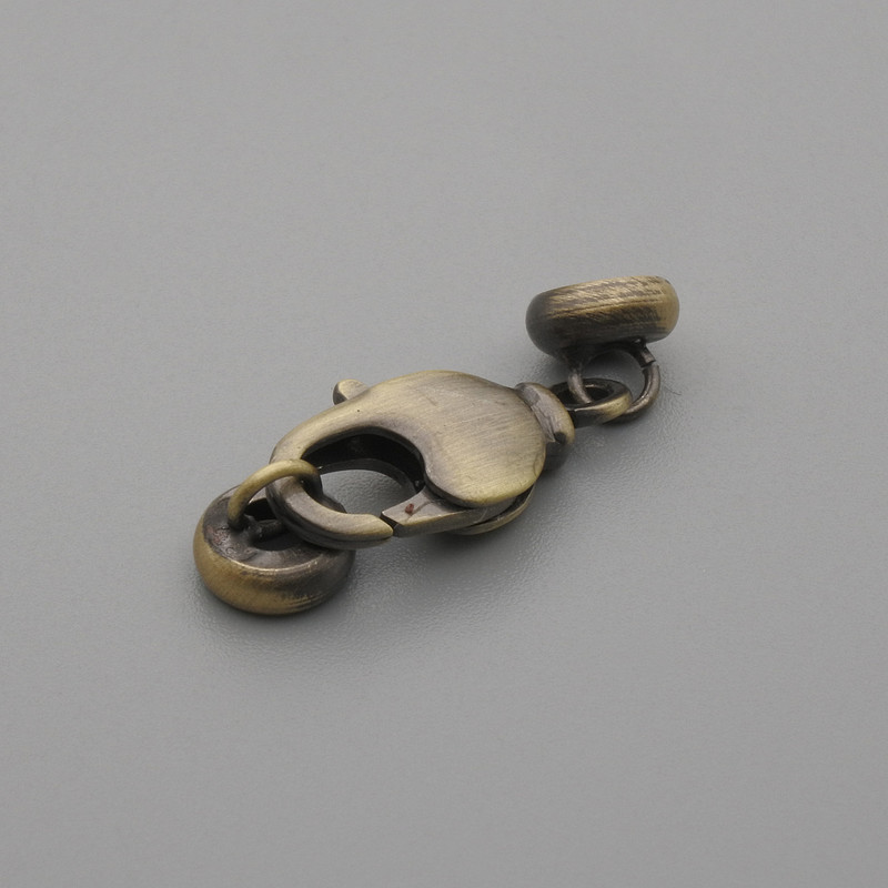 Karabinkové zapínání, průměr 17×7 mm (+-), průměr 6 mm (+-), bronzová barva kovu