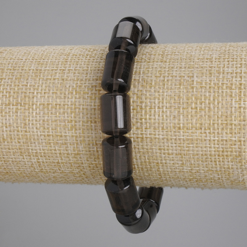 Náramek z rauhotopazu cylindrického tvaru, průměr 15×10 mm, délka 18 cm, elastická šňůrka
