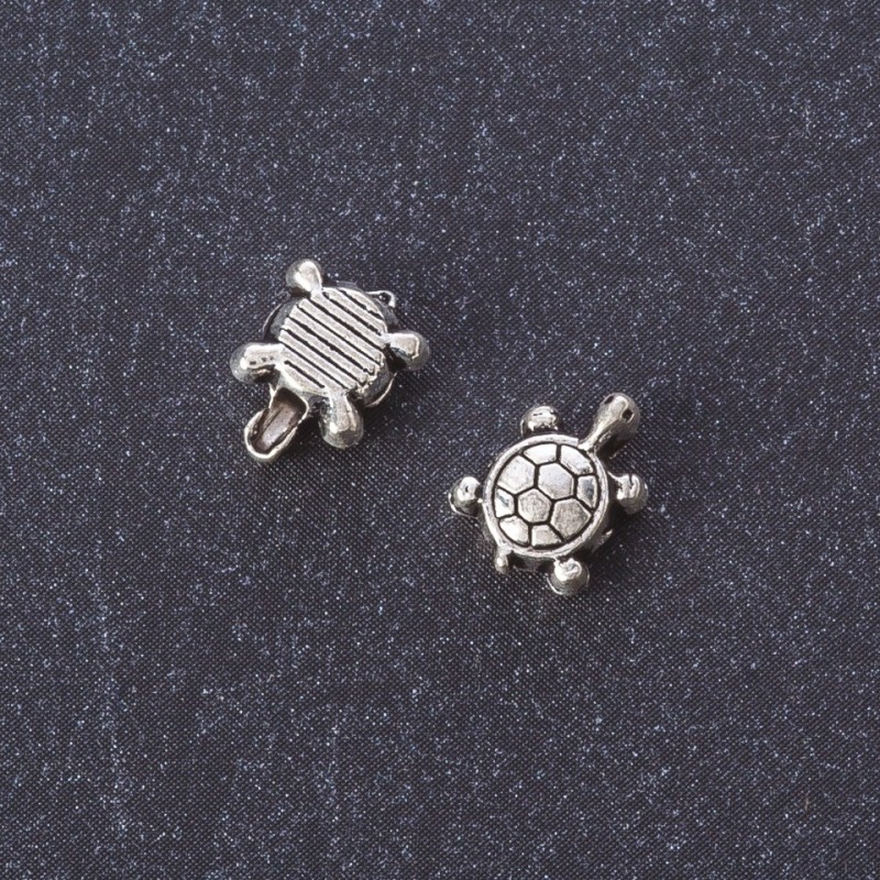 Kovové komponenty – korálková vložka želvička, barva kovu stříbrná, 7×8 mm, balení 20 g +/- 40 ks