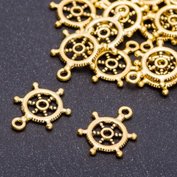 Přívěsek – kovová součástka „Kormidlo“, průměr 15 mm, délka 20 mm, otvor 5 mm, balení 20 g ± 21 ks