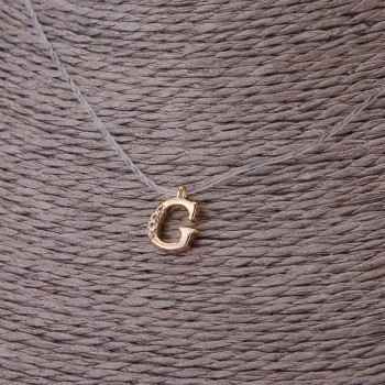 Přívěšek, průměr 9 mm na neviditelném silikonovém šňůře, délka 39–44 cm