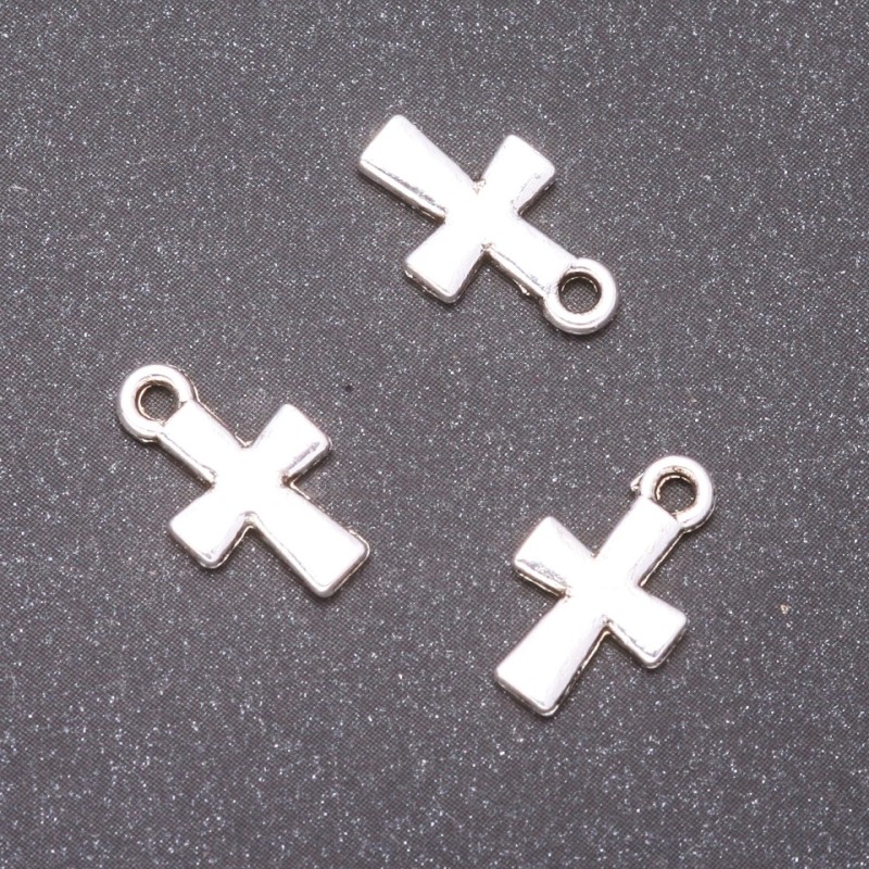 Přívěšek ve tvaru kříže, rozměry 14×9 mm, otvor 1,5 mm, balení 20 g ± 41 ks