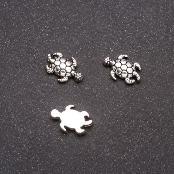 Furnitura – korálková vložka ve tvaru želva, průměr 13×9 mm, vnitřní průměr 1 mm, balení 20 g ± 23 ks