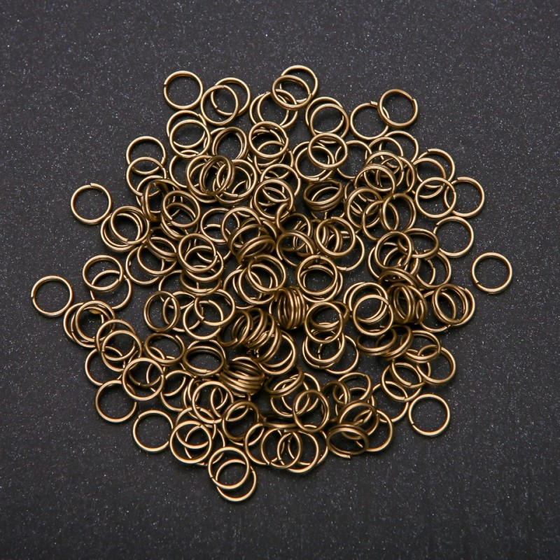 Bronzově zbarvené pružinové očko, průměr 7 mm, balení 20 g
