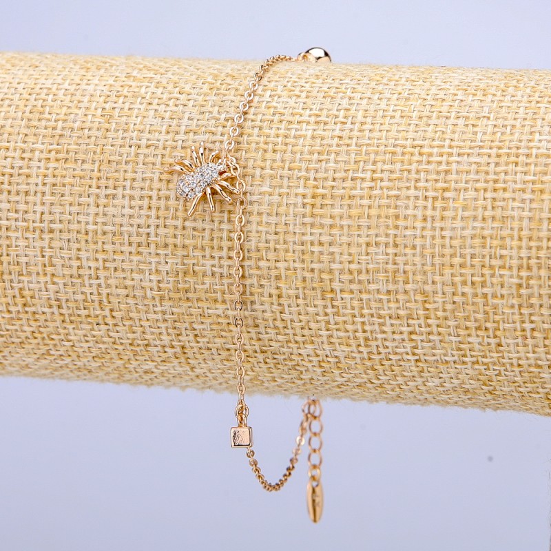 Náramek Xuping 18K pozlacení s bílými štrasami