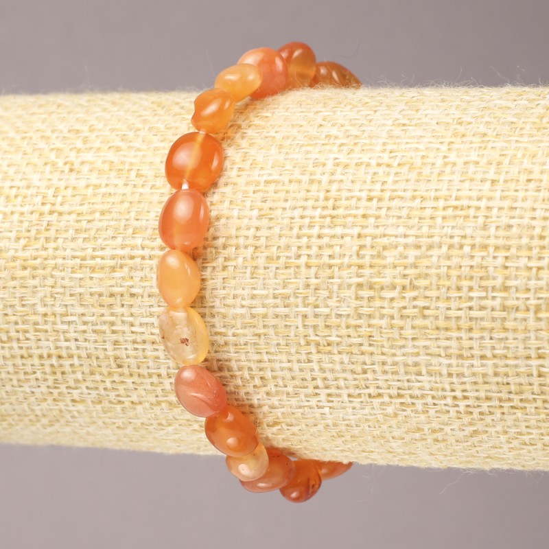 Náramek z karneolu na gumičce, broušené korálky, průměr 9×7 mm