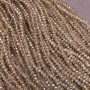 Korálky českého křišťálu na niti, šampaň průhledné s benzínovým odleskem, brusovaný rondel, průměr 3,5×3 mm, délka 36–38 cm