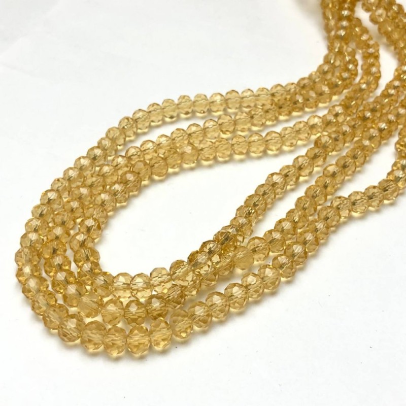 České křišťálové korálky na vlasci, medově žluté průhledné, fasetované rondely, průměr 8×6 mm, délka 40–42 cm