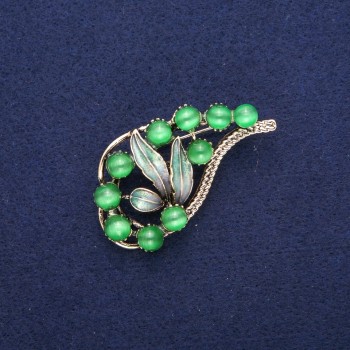 Brož Větvička se zeleným kočičím okem a smaltem, zlatý kov 28 × 52 mm