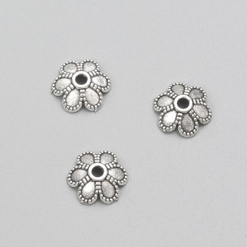 Koncovka kovová, barva kovu stříbrná, průměr 9×3 mm, balení: 20 g, cca 62 ks