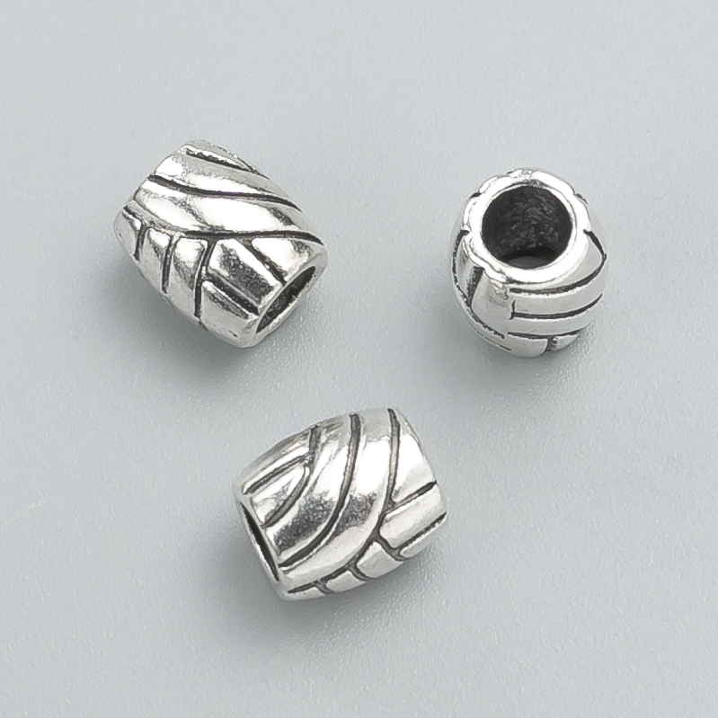 Kovová korálka-vložka, průměr 9×8 mm, balení 12 ks ±, barva kovu 'stříbro'