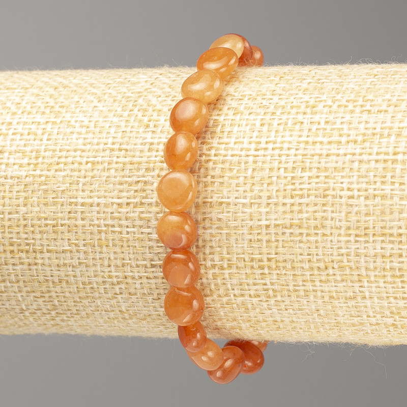 Náramek z karneolu, facetovaný na gumičce, průměr 7×8 mm, délka 18 cm