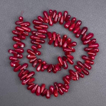 Přírodní korálová zrníčka, průměr 13×6 mm, délka cca 40 cm, navlečené na vlascu