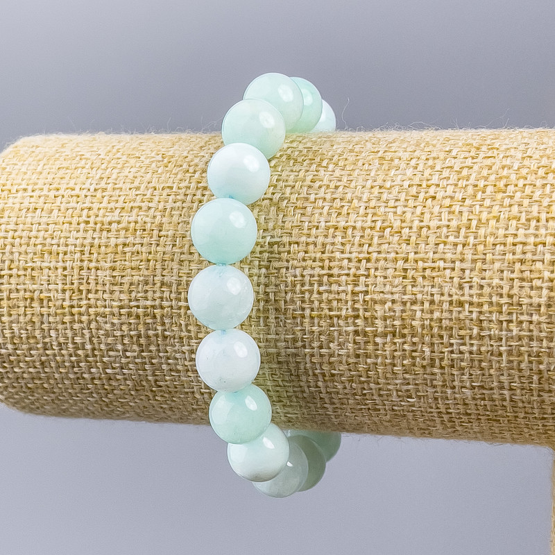 Náramek z larimaru, přírodní kámen, hladké korálky na niti, průměr cca 10 mm, délka 18 cm (elastická šňůrka)