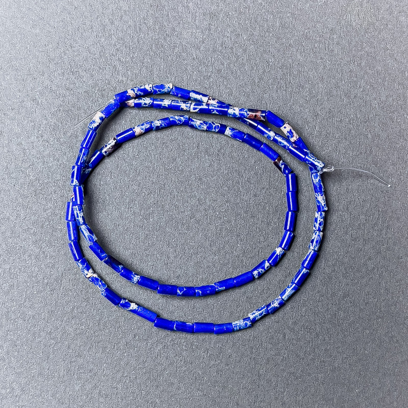 Korálky variscitu modré lisované, brusované, průměr 2×4 mm, délka 38 cm, na niti