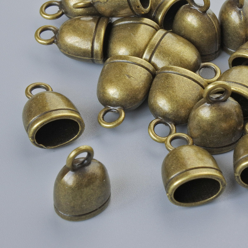Koncovka pro bižuterii, průměr 13×9×7 mm, otvor 2,3 mm a 7×5 mm, balení 18 ks ± bronzová barva kovu