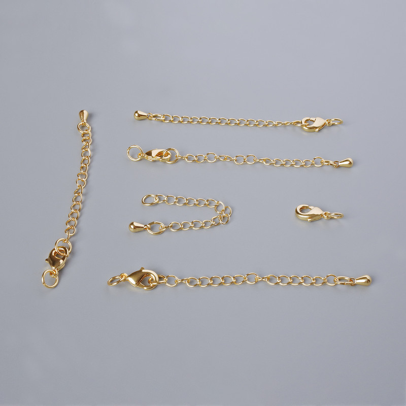 Kovová zapínací karabina, rozměr 10×5 mm, s prodlužovacím řetízkem, délka 5,5 cm, zlatý odstín kovu, 1 ks